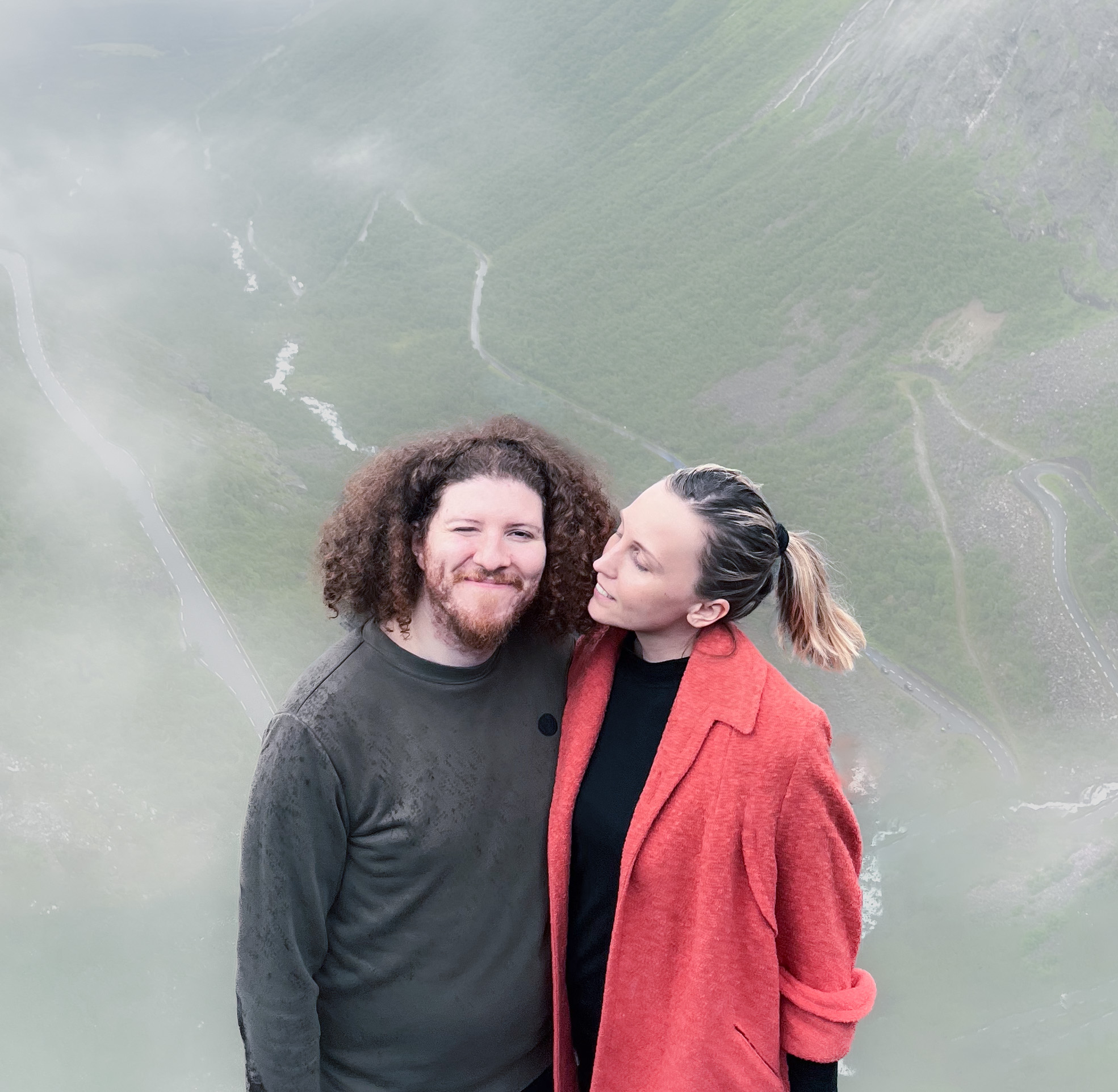 Two people, misty background.