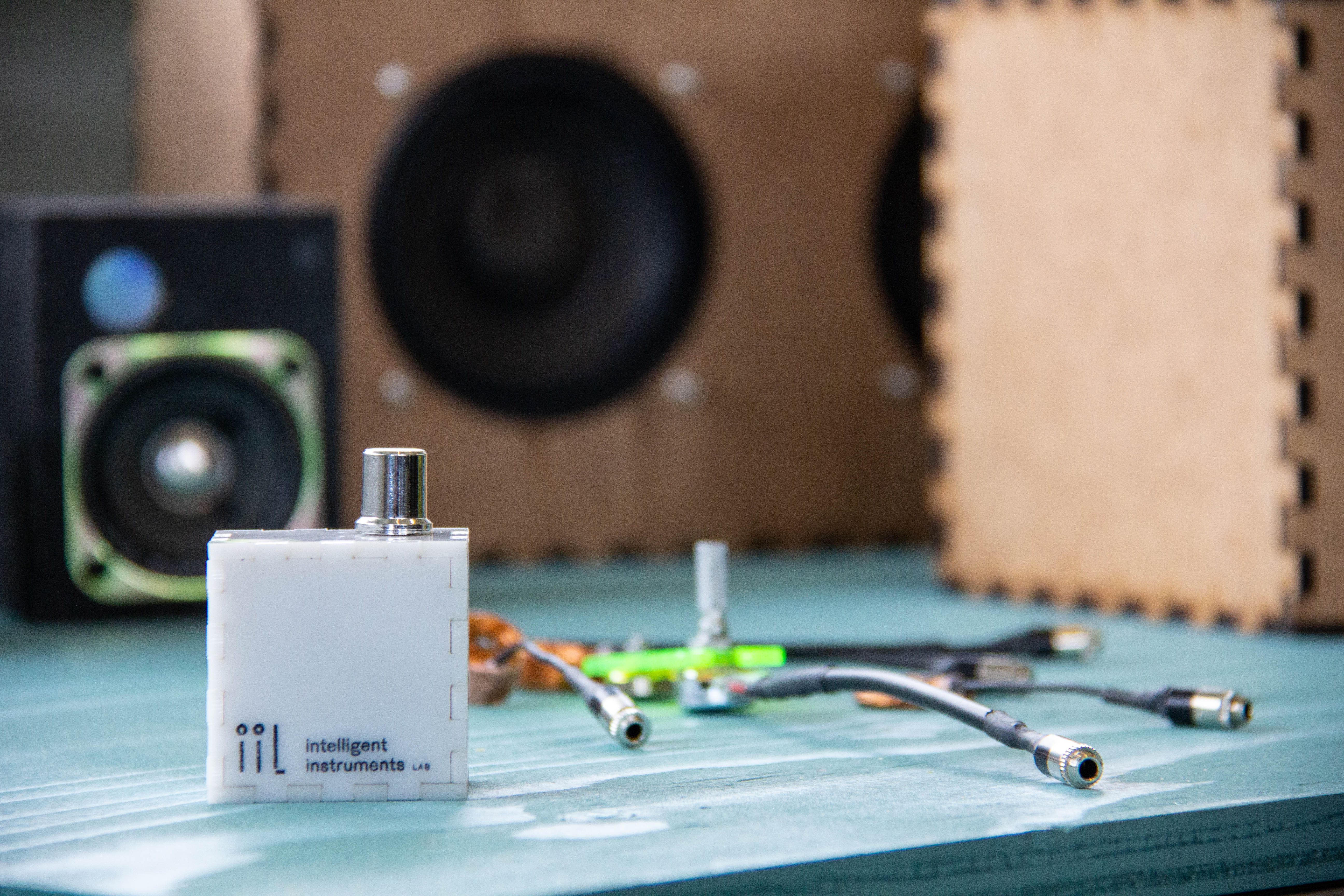 Various pieces of technical elements spread out on a blue table.