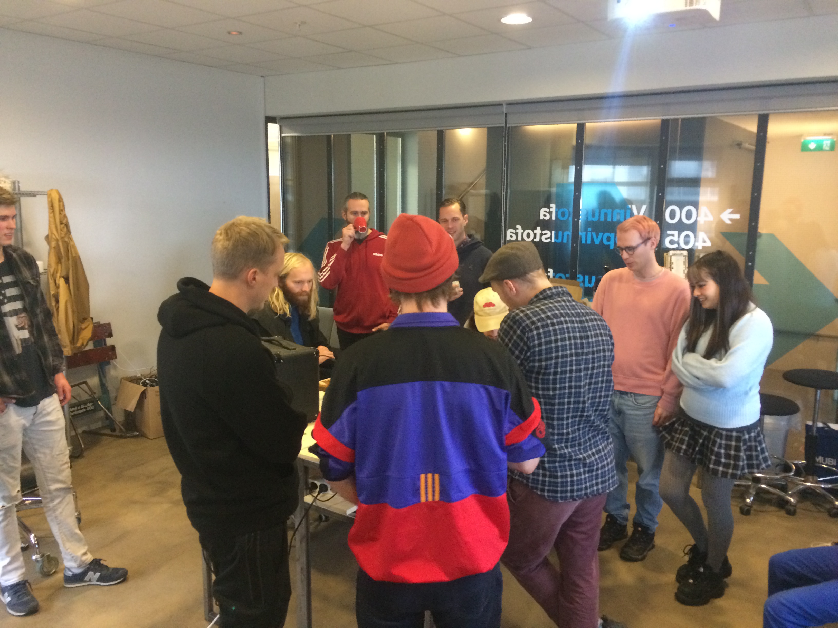 A group of people discussing the instrument.
